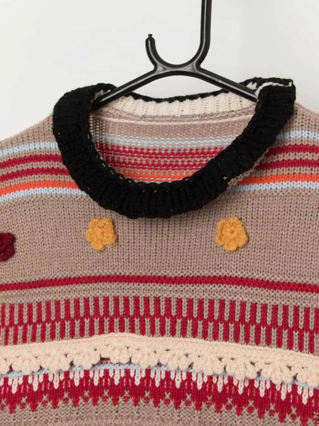 Colourful knitted sweater vest with stripes and florals – Medium